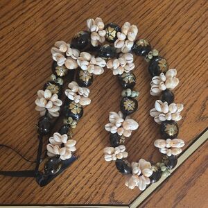 traditional Polynesian-style shell and nut lei necklace